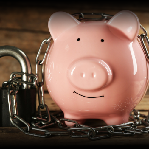 Smiling pink piggy bank secured with chain link and padlock, symbolizing the financial security and protection provided by car insurance in Montana