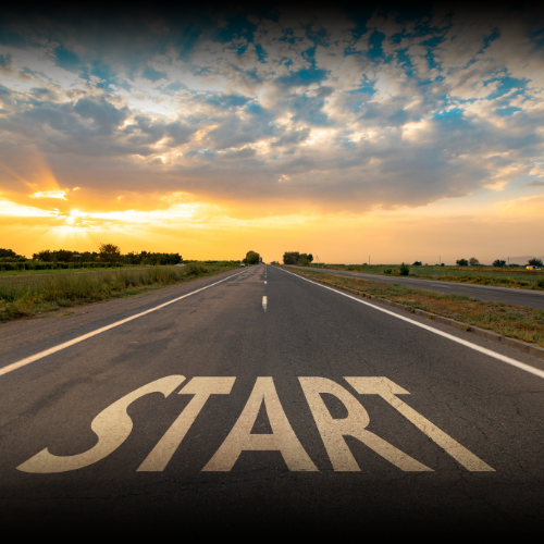 A wide-angle view of a highway stretching to the horizon, with the word 'Start' painted on the road, symbolizing the beginning of your commercial auto insurance journey with Armor Insurance Agency