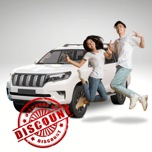 Composite image featuring a white SUV in the background, a couple jumping in the air in the midground, and a red circular stamp in the foreground with the word 'Discount'. The image symbolizes the excitement and satisfaction of receiving discounts on auto insurance in Miles City, MT.