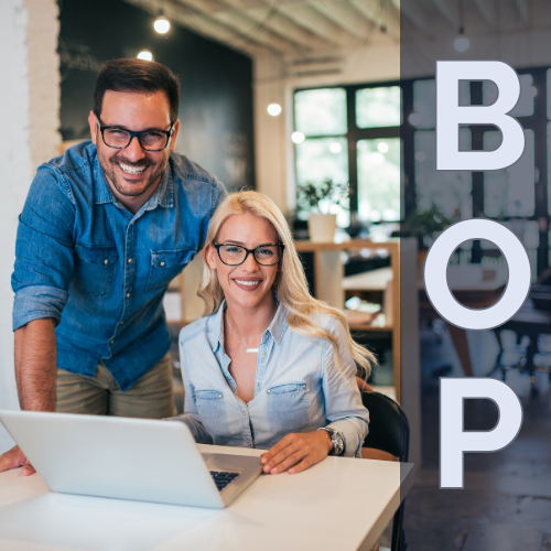 Smiling husband and wife in their mid-30s working together in a modern small business office, with a laptop on the table and a “BOP” graphic, representing a Businessowners Policy as a good fit for small businesses