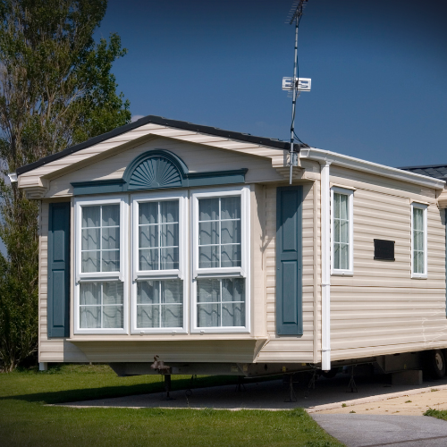 New mobile home recently placed on a pad, representing homes covered by mobile home insurance.